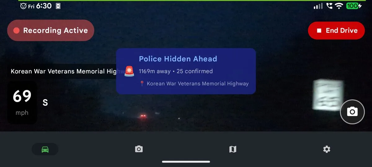 DriveSight alert showing a hidden police report ahead on the route while the dashcam records